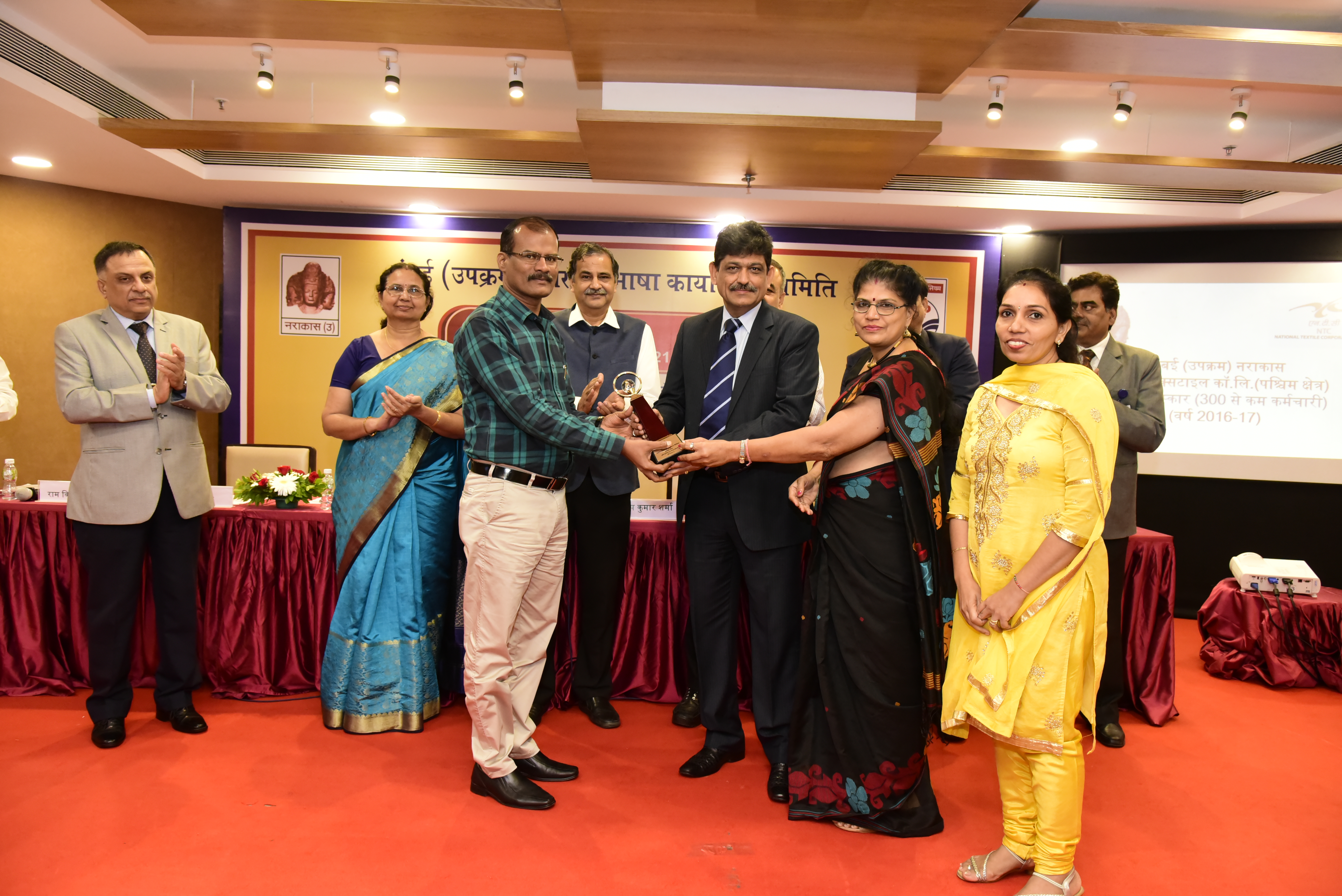 TOLIC 2016-17 : Western Regional Office, Mumbai, NTC Ltd has received the third award of the TOLIC for outstanding performance for the year 2016-17. This award was given by the President Sh. Mukesh Kumar Khurana on 21 July 2017. This award belongs to all the workers / employees of the corporation and the official category.